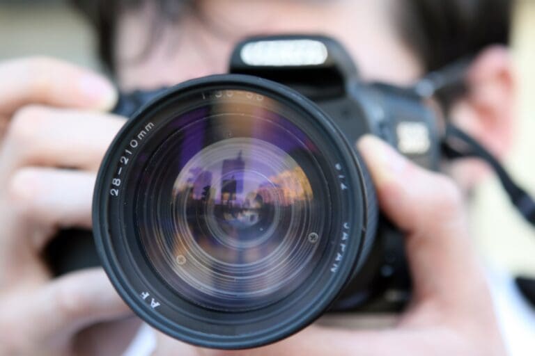 A person holding a camera taking a picture.