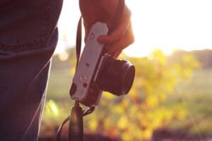 A person holding a camera in their hand.