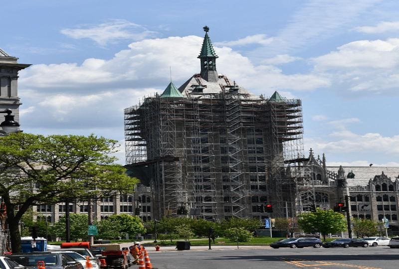 A building under construction with scaffolding around it.